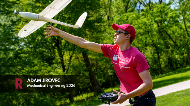 Adam Jirovec holds his 3D printed plane