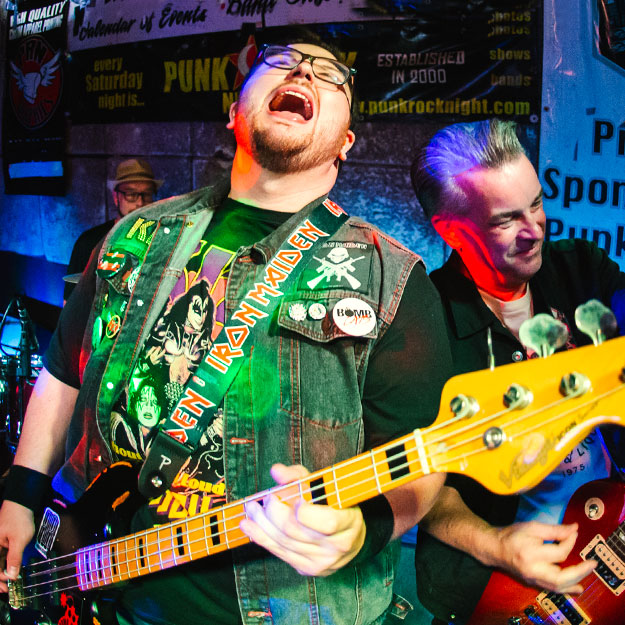 Russ Webster and bandmates play a show.