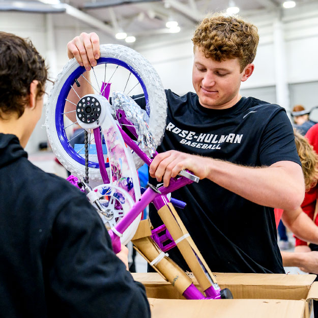 Students assemble a bike.