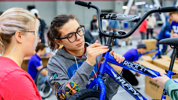 Students assemble a bike.