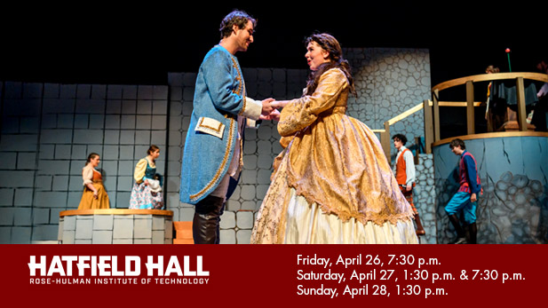 Students playing the roles of Belle and Beast clasp hands onstage.