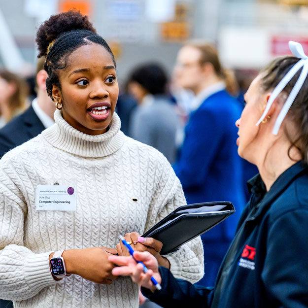 A student talks to a recruiter at Rose-Hulman's winter career fair.