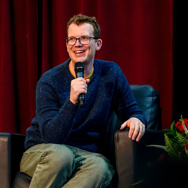 Hank Green waves to the crowd in the Sports & Recreation Center.
