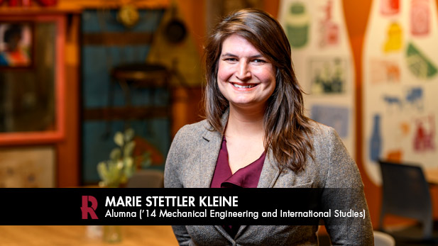 Marie Stettler Kleine, wearing a blazer, smiles.