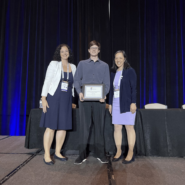 Aiden Walter receiving an award.
