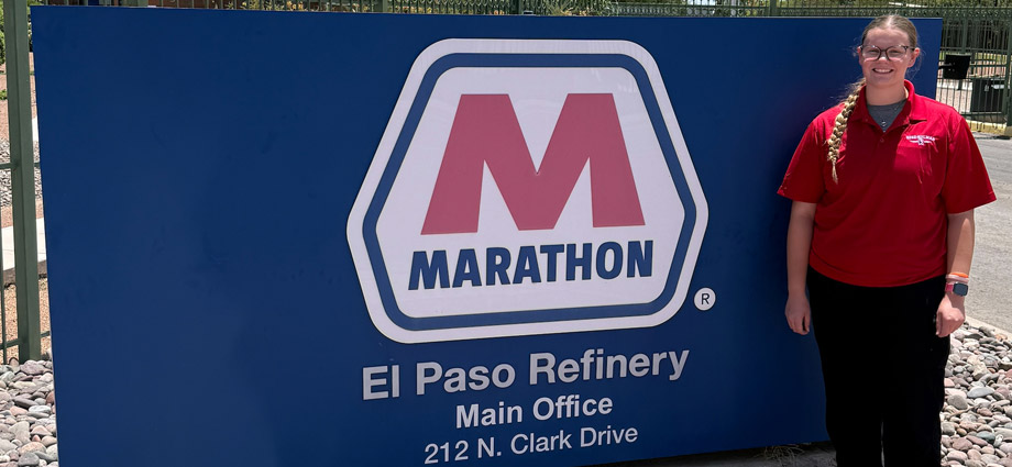 Brooke Carpenter in front of the Marathon Petroleum sign.