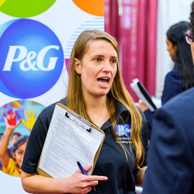 A student speaks with an employer at the Fall Career Fair.