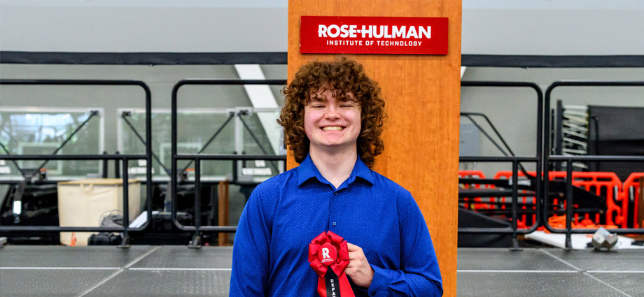 Daniel Gerber holds a red award ribbon.
