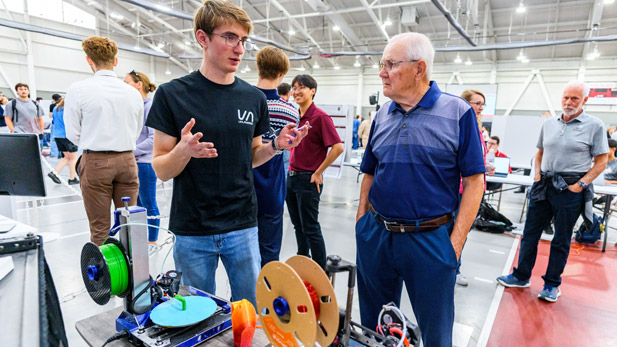 A student explains the Unlayered project, a 3D printer that prints without supports. 