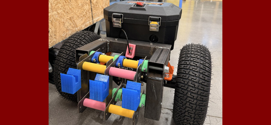 An electric book dolly with large wheels and 3D printed parts.