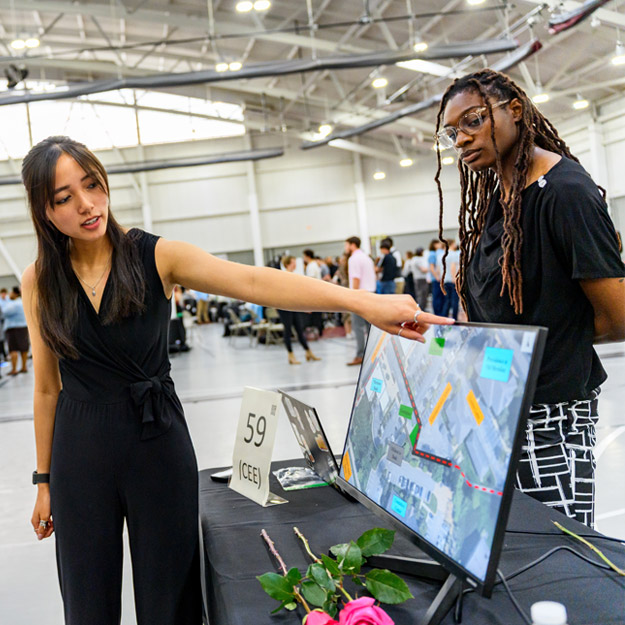 A robot with googly eyes and a department award ribbon.