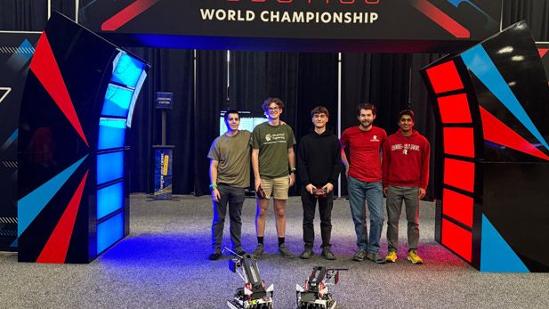 VEX U students and their robots at the World Championships.