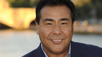 Close-up headshot of John Quinones