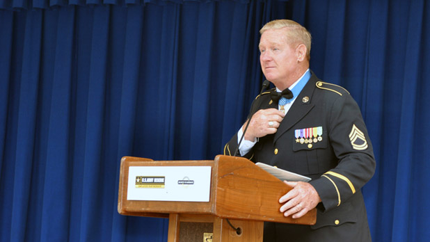 Sammy Lee Davis speaking at a podium
