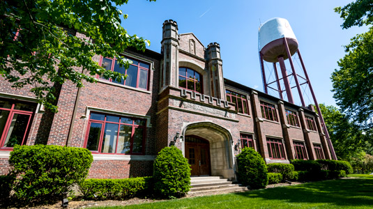 Exterior view of Hadley Hall with the Rose-Hulman water tower in the distance.
