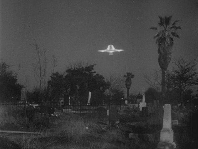 Plan 9 saucer hovering over graveyard